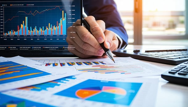 A financial controller analyzing charts and graphs