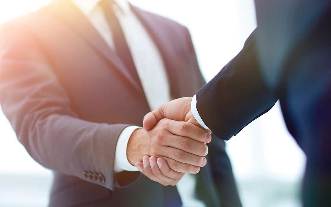 Financiers shaking hands after debt equity financing deal