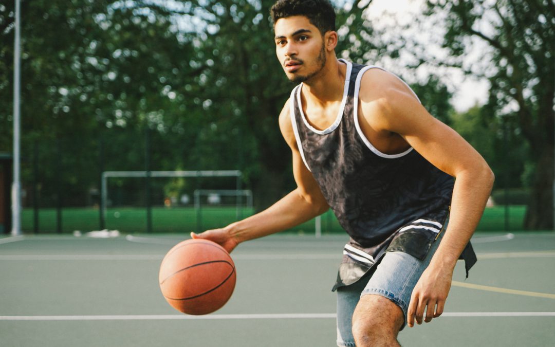 Basketball Player in Athletic Stance Representing Business Athletic Position